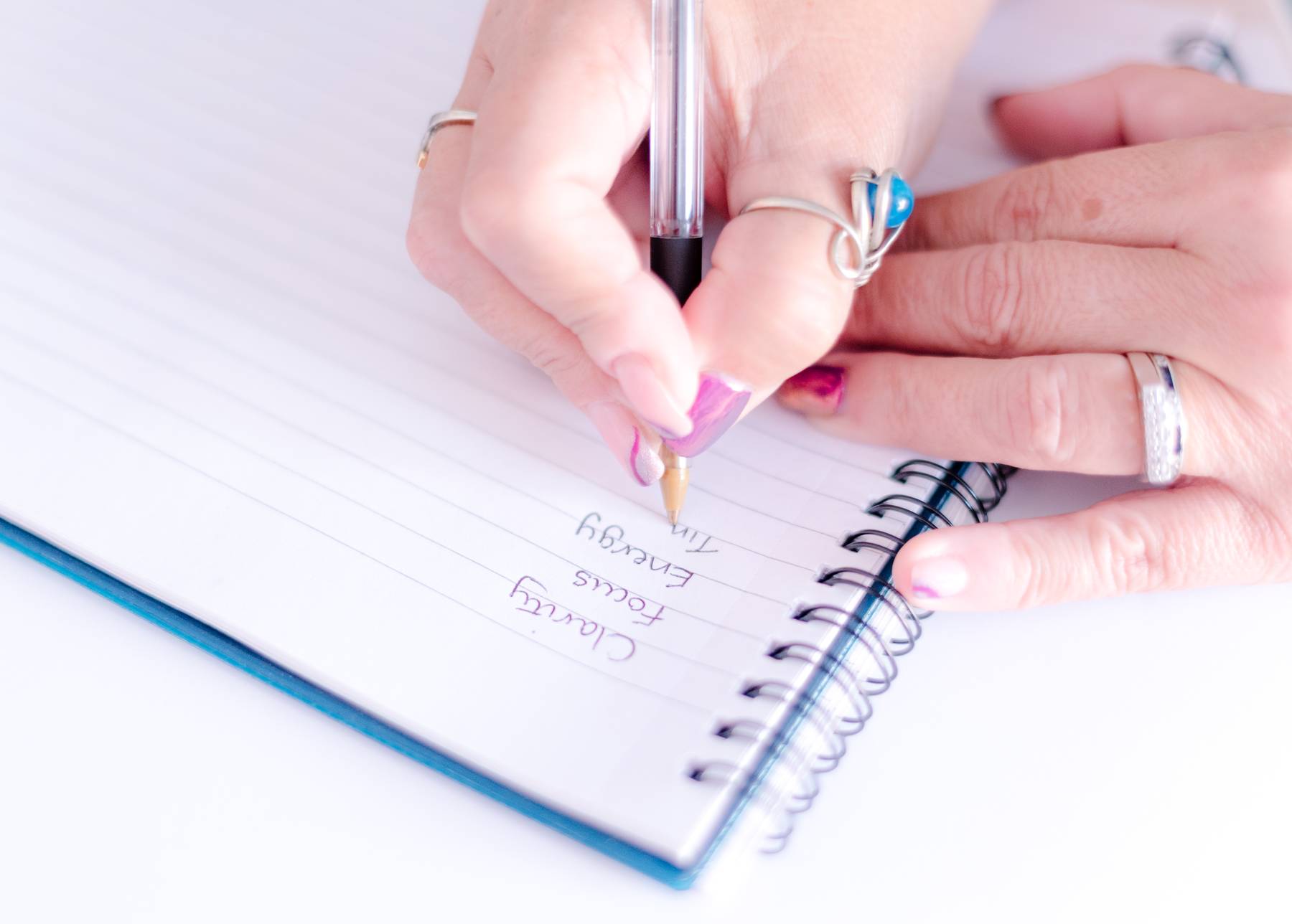 Close up of Sian writing in a notebook